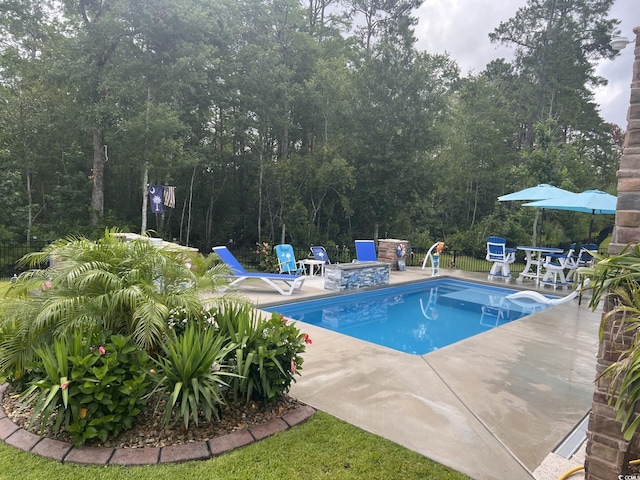 405 Palo Verde Dr, Myrtle Beach, SC 29579 - view of pool featuring a patio area, a water slide, and a fire pit