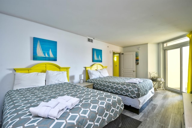 2711 S Ocean Blvd Unit 1522, North Myrtle Beach, SC 29582 - bedroom featuring wood finished floors