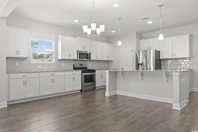 225 Astoria Park Loop, Conway, SC 29526 - kitchen with stainless steel appliances, backsplash, white cabinetry, recessed lighting, and dark wood finished floors