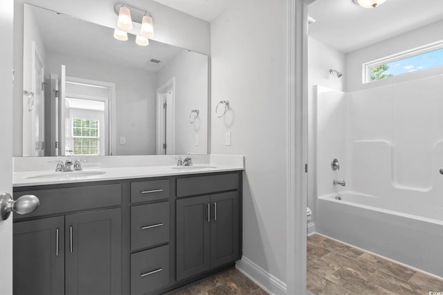 225 Astoria Park Loop, Conway, SC 29526 - full bathroom featuring double vanity, stone finish floors, and shower / tub combination