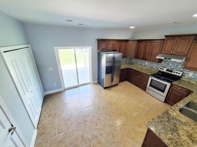 1017 Dinger Dr Unit 1017, Myrtle Beach, SC 29588 - kitchen featuring stainless steel appliances, under cabinet range hood, decorative backsplash, dark stone counters, and light tile patterned floors