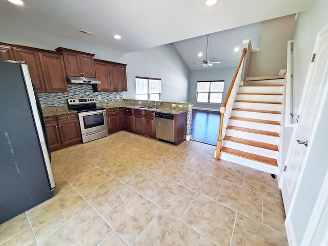 1017 Dinger Dr Unit 1017, Myrtle Beach, SC 29588 - kitchen featuring appliances with stainless steel finishes, under cabinet range hood, a ceiling fan, lofted ceiling, and light tile patterned flooring
