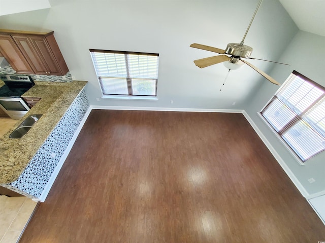 1017 Dinger Dr Unit 1017, Myrtle Beach, SC 29588 - unfurnished living room featuring wood finished floors, a ceiling fan, and vaulted ceiling
