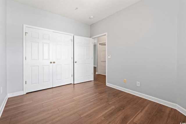 105 Ashley Park Dr Unit 2B, Myrtle Beach, SC 29579 - unfurnished bedroom featuring wood finished floors and a closet