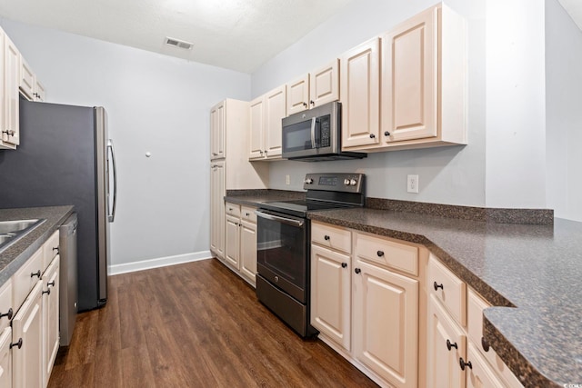 105 Ashley Park Dr Unit 2B, Myrtle Beach, SC 29579 - kitchen with appliances with stainless steel finishes, dark wood-type flooring, and dark countertops