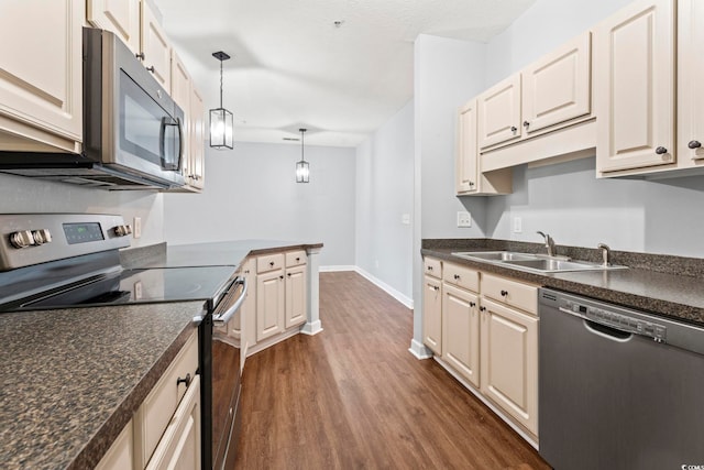 105 Ashley Park Dr Unit 2B, Myrtle Beach, SC 29579 - kitchen with appliances with stainless steel finishes, dark wood-style floors, and dark countertops