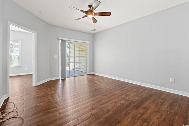 105 Ashley Park Dr Unit 2B, Myrtle Beach, SC 29579 - spare room with healthy amount of natural light, dark wood finished floors, and a ceiling fan