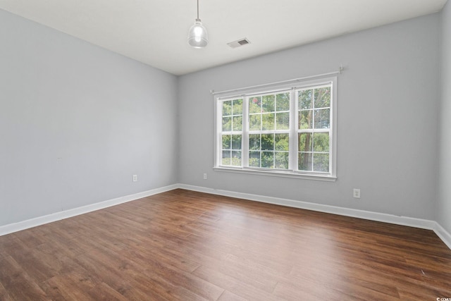 105 Ashley Park Dr Unit 2B, Myrtle Beach, SC 29579 - spare room with dark wood-style floors and baseboards