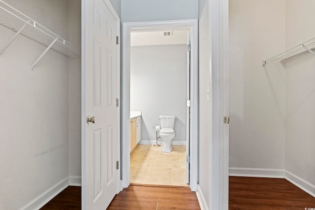 105 Ashley Park Dr Unit 2B, Myrtle Beach, SC 29579 - walk in closet featuring wood finished floors
