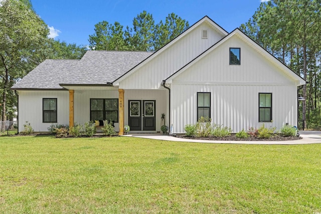 7405 Louisville Rd, Aynor, SC 29511 - view of front of property featuring a shingled roof, a front yard, and a porch
