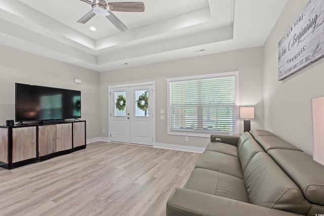 7405 Louisville Rd, Aynor, SC 29511 - living room with a tray ceiling, light wood-style flooring, ceiling fan, and recessed lighting