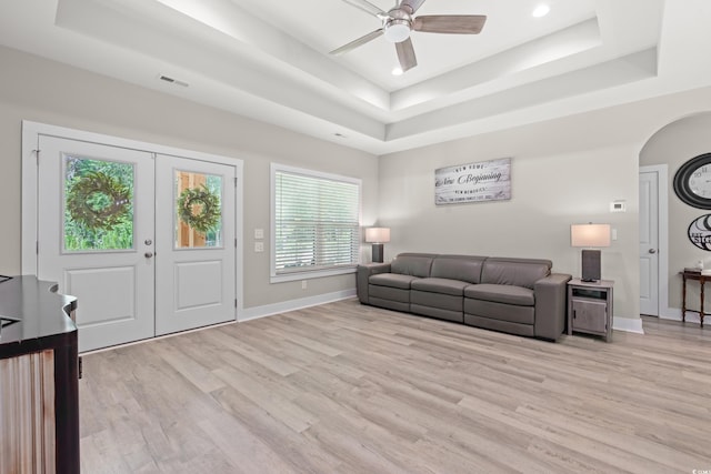7405 Louisville Rd, Aynor, SC 29511 - living room featuring a raised ceiling, arched walkways, light wood-type flooring, ceiling fan, and recessed lighting