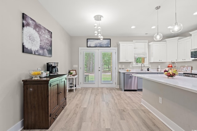 7405 Louisville Rd, Aynor, SC 29511 - kitchen featuring appliances with stainless steel finishes, white cabinets, light wood-style floors, and recessed lighting
