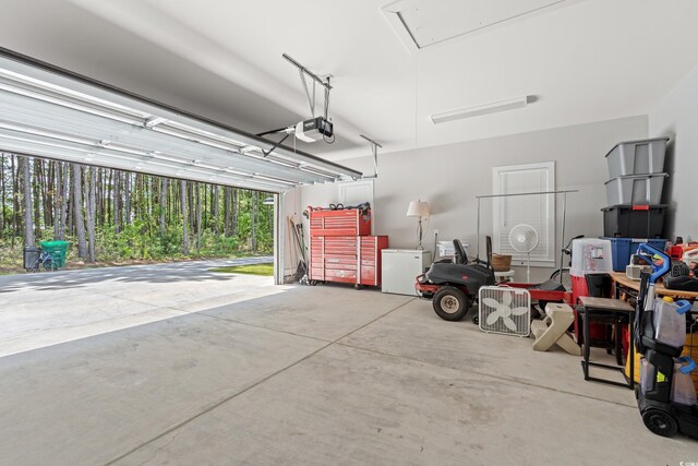 7405 Louisville Rd, Aynor, SC 29511 - garage featuring a garage door opener