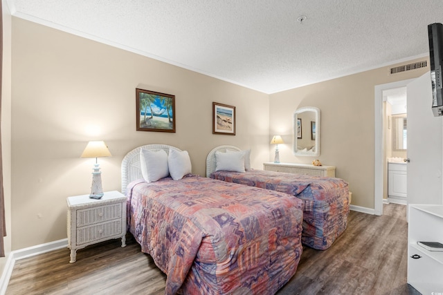 415 Ocean Creek Dr Unit 2243, Myrtle Beach, SC 29572 - bedroom with wood finished floors, a textured ceiling, and ornamental molding