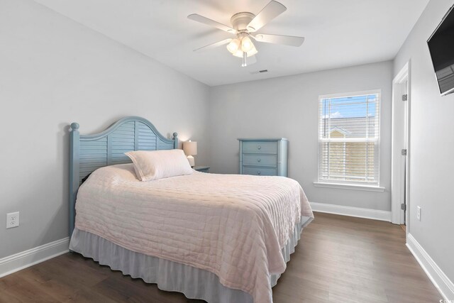 1514-B S Ocean Blvd, Surfside Beach, SC 29575 - bedroom with wood finished floors and ceiling fan