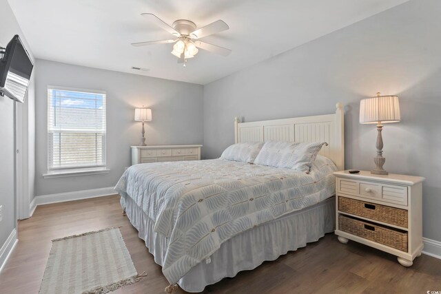 1514-B S Ocean Blvd, Surfside Beach, SC 29575 - bedroom featuring wood finished floors and a ceiling fan
