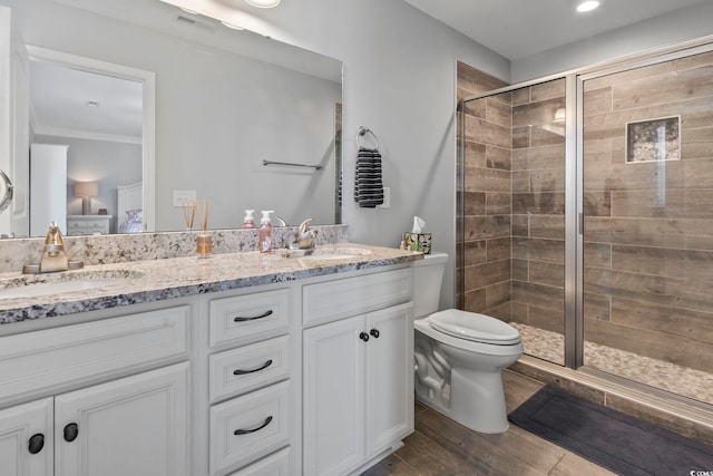 1514-B S Ocean Blvd, Surfside Beach, SC 29575 - bathroom featuring double vanity, a stall shower, wood finished floors, and crown molding