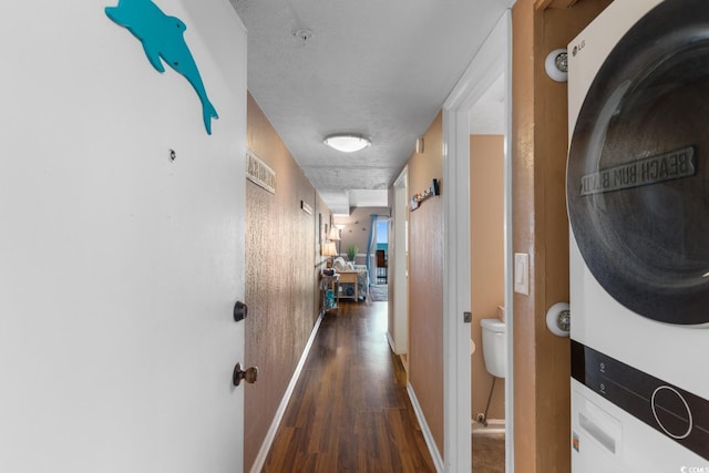 3217 S Ocean Blvd Unit 305, North Myrtle Beach, SC 29582 - hall with stacked washing machine and dryer and dark wood-style flooring