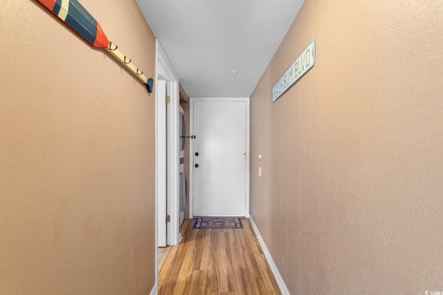 3217 S Ocean Blvd Unit 305, North Myrtle Beach, SC 29582 - hall featuring light wood-type flooring and baseboards