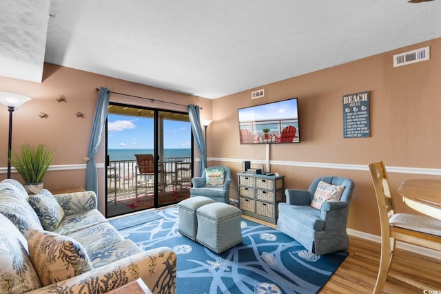 3217 S Ocean Blvd Unit 305, North Myrtle Beach, SC 29582 - living room with wood finished floors and baseboards