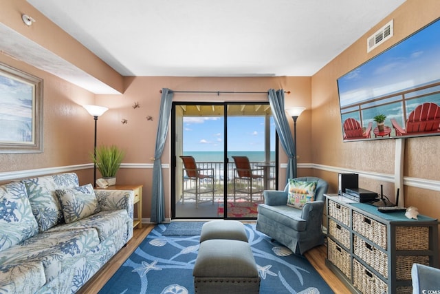 3217 S Ocean Blvd Unit 305, North Myrtle Beach, SC 29582 - living room featuring wood finished floors