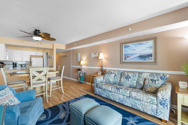 3217 S Ocean Blvd Unit 305, North Myrtle Beach, SC 29582 - living area with light wood-type flooring and ceiling fan