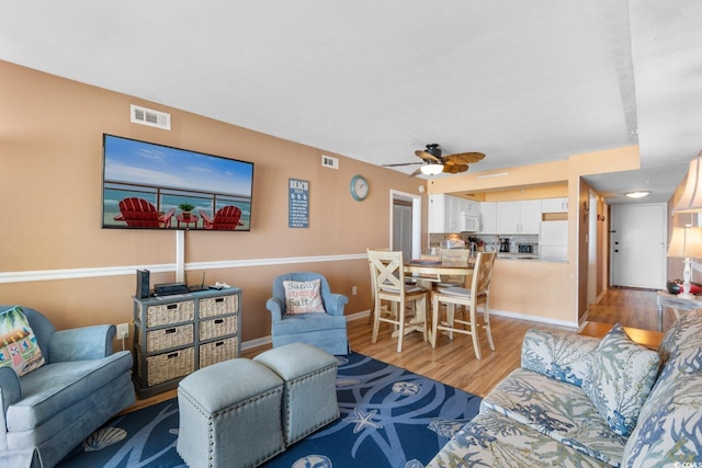 3217 S Ocean Blvd Unit 305, North Myrtle Beach, SC 29582 - living area featuring light wood finished floors and a ceiling fan