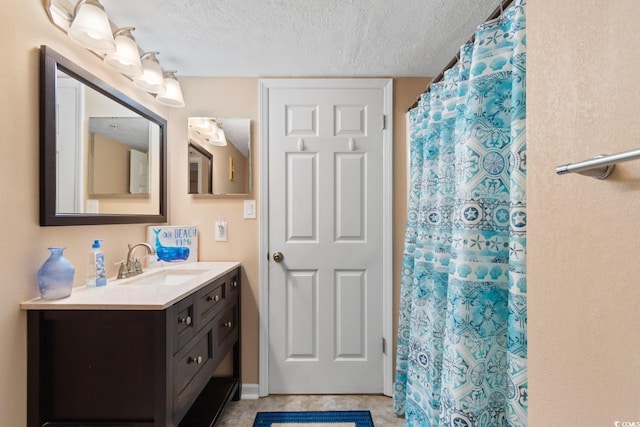 3217 S Ocean Blvd Unit 305, North Myrtle Beach, SC 29582 - full bath featuring vanity, a textured ceiling, and a shower with curtain