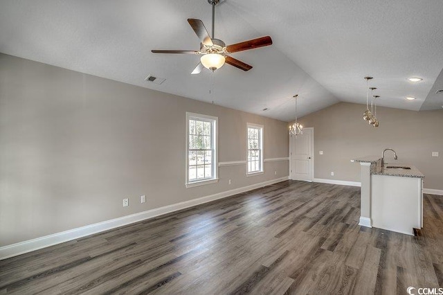 5087 Marigold Rd, Conway, SC 29527 - unfurnished living room featuring lofted ceiling, a chandelier, dark wood-type flooring, and a ceiling fan