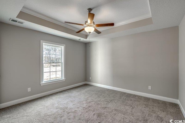 5087 Marigold Rd, Conway, SC 29527 - empty room featuring a raised ceiling, ornamental molding, carpet, a ceiling fan, and a textured ceiling