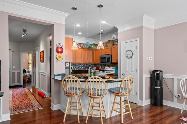 190 Olde Towne Way Unit 3, Myrtle Beach, SC 29588 - kitchen with stainless steel microwave, white electric stove, dark countertops, a peninsula, and crown molding