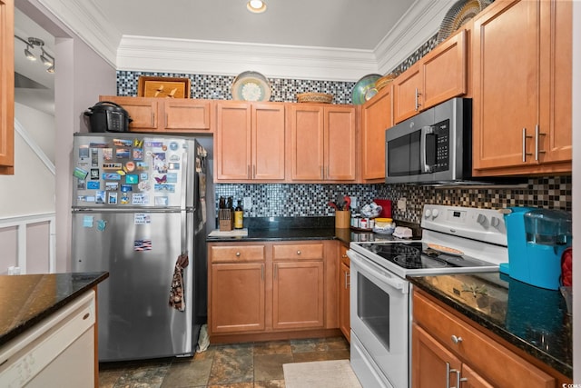 190 Olde Towne Way Unit 3, Myrtle Beach, SC 29588 - kitchen with appliances with stainless steel finishes, crown molding, tasteful backsplash, dark stone counters, and dark stone finish flooring