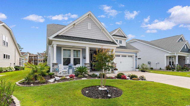 3382 Eversheen Dr, Little River, SC 29566 - craftsman-style house with covered porch, driveway, an attached garage, a front lawn, and roof with shingles