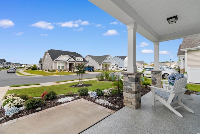 3382 Eversheen Dr, Little River, SC 29566 - covered porch featuring a residential view and a lawn