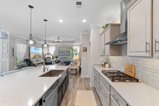 3382 Eversheen Dr, Little River, SC 29566 - kitchen with appliances with stainless steel finishes, wall chimney range hood, open floor plan, crown molding, and backsplash