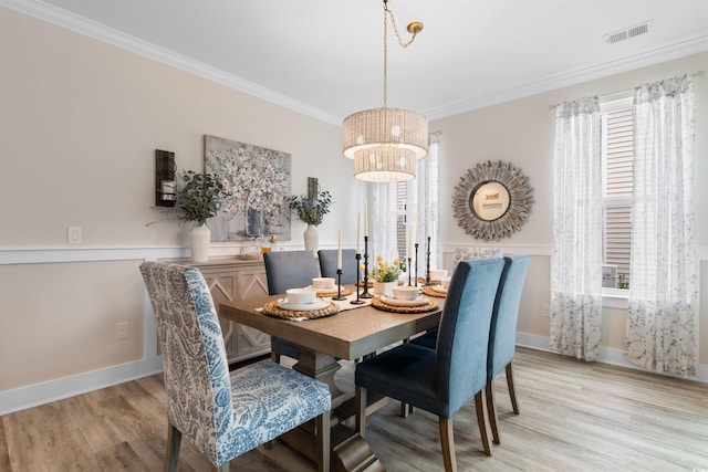 3382 Eversheen Dr, Little River, SC 29566 - dining room featuring light wood finished floors, crown molding, and plenty of natural light