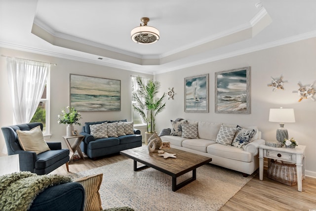 3382 Eversheen Dr, Little River, SC 29566 - living room featuring a tray ceiling, light wood-style floors, and ornamental molding