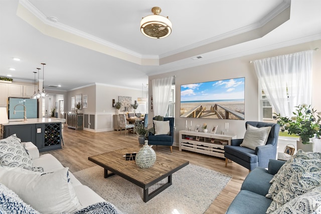 3382 Eversheen Dr, Little River, SC 29566 - living area with a raised ceiling, crown molding, and light wood-type flooring