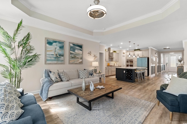 3382 Eversheen Dr, Little River, SC 29566 - living area featuring ornamental molding, light wood finished floors, a tray ceiling, and recessed lighting