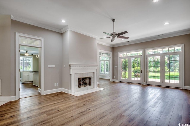 3535 Golf Ave, Little River, SC 29566 - unfurnished living room featuring a ceiling fan, crown molding, wood finished floors, a fireplace, and recessed lighting