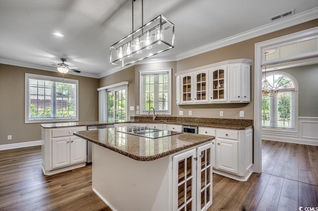 3535 Golf Ave, Little River, SC 29566 - kitchen featuring dishwasher, white cabinets, a kitchen island, glass insert cabinets, and crown molding