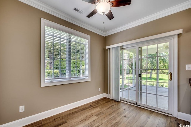 3535 Golf Ave, Little River, SC 29566 - empty room featuring healthy amount of natural light, crown molding, wood finished floors, and ceiling fan