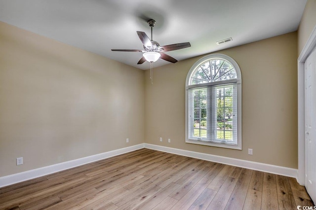 3535 Golf Ave, Little River, SC 29566 - empty room with wood finished floors and a ceiling fan