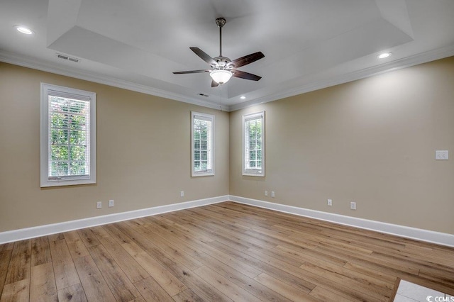 3535 Golf Ave, Little River, SC 29566 - spare room with crown molding, light wood-style flooring, healthy amount of natural light, ceiling fan, and a tray ceiling
