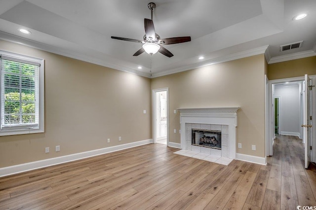 3535 Golf Ave, Little River, SC 29566 - unfurnished living room featuring ornamental molding, ceiling fan, light wood finished floors, a tile fireplace, and recessed lighting