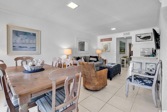 10200 Lake Shore Dr Unit 26, Myrtle Beach, SC 29572 - dining area featuring light tile patterned floors and a textured ceiling