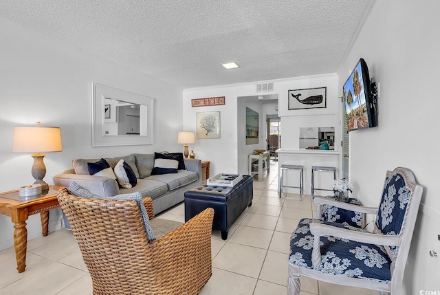 10200 Lake Shore Dr Unit 26, Myrtle Beach, SC 29572 - living room featuring light tile patterned flooring and a textured ceiling