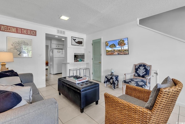 10200 Lake Shore Dr Unit 26, Myrtle Beach, SC 29572 - living area featuring light tile patterned floors and a textured ceiling