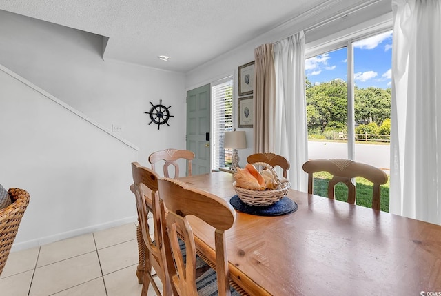 10200 Lake Shore Dr Unit 26, Myrtle Beach, SC 29572 - dining space with light tile patterned flooring and a textured ceiling
